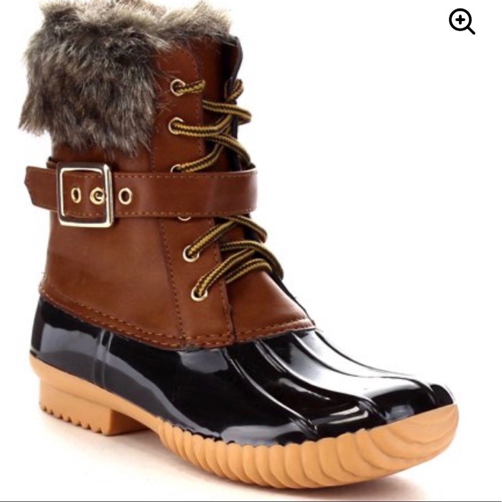 Brown and black duck boots